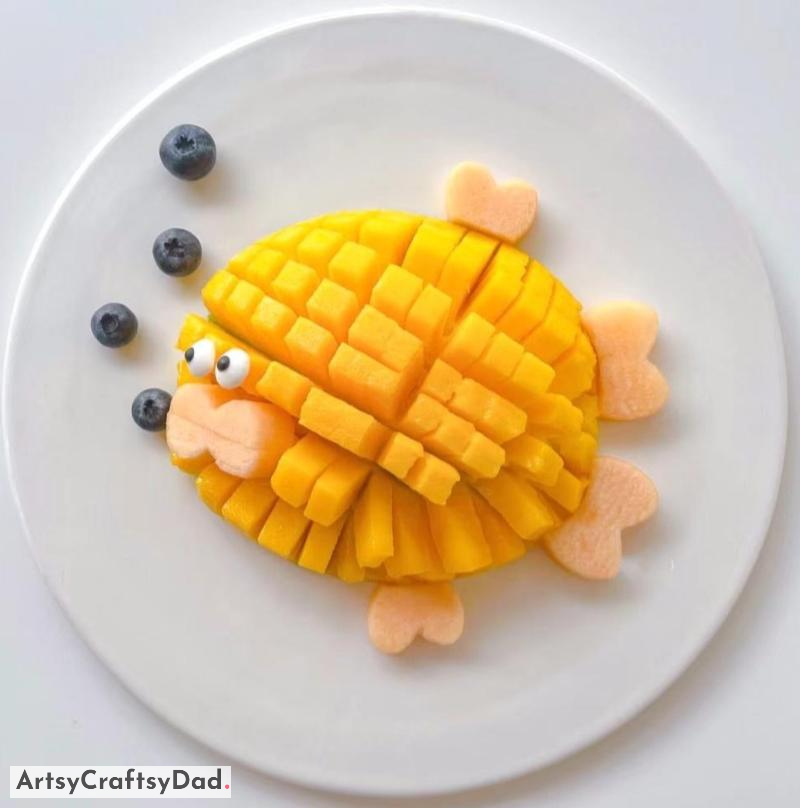 Fish Themed Food Plating Decoration using Mango - Dishes with a Fish Theme presented with Mango Adornment