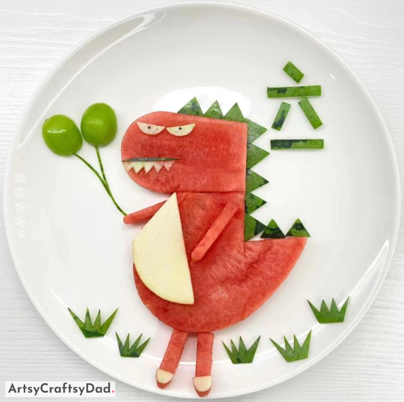 Fruit Dinosaur Decoration Idea For Kids Food Plating - A concept for kids' food presentation featuring dinosaur-shaped fruits
