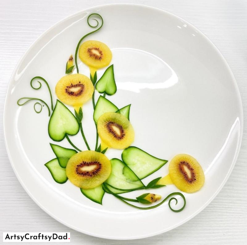 Fruit Plate Decoration Idea Using Kiwi and Cucumber Carving - An idea for arranging a platter of fruit with fashioned Kiwi and Cucumber