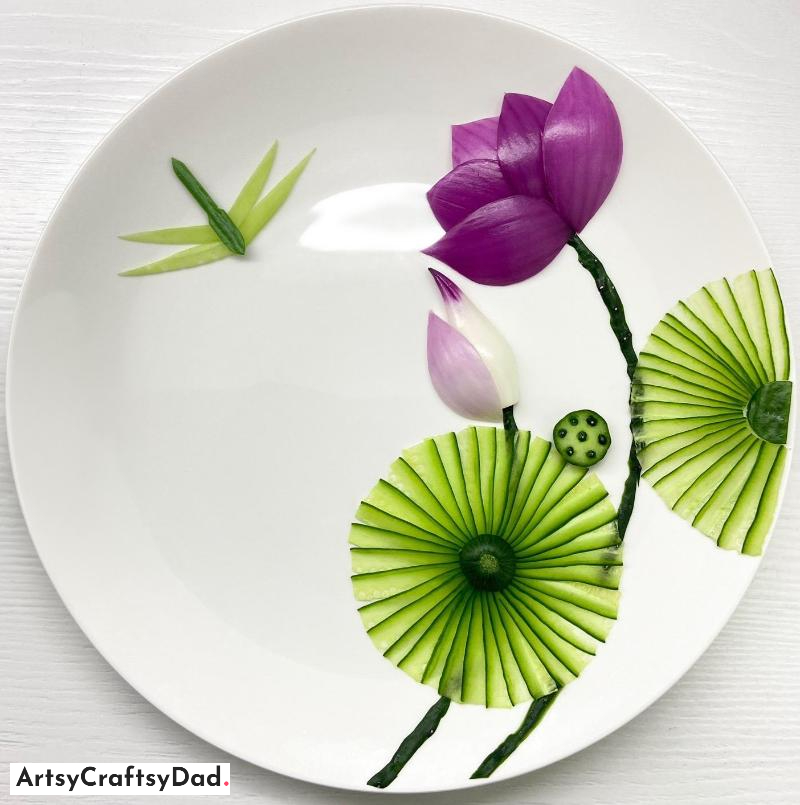 Lotus Themed Plate Decoration Idea Using Onion and Cucumber - A way to decorate a plate with a lotus theme utilizing onion and cucumber