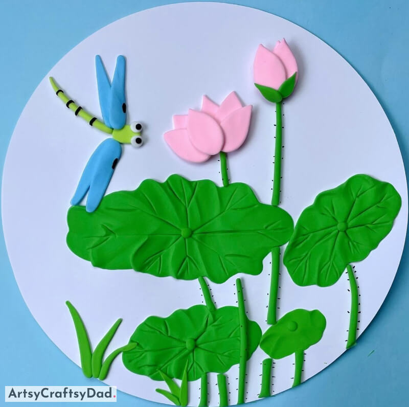 Lovely lotus blossoms with a charming insect hovering above it. - Design Special and Appealing Flowery Crafts 