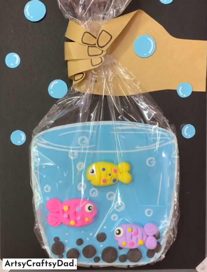 Paper Hand Holding Clay Fish Aquarium Craft - Get creative with clay - craft ideas for kids