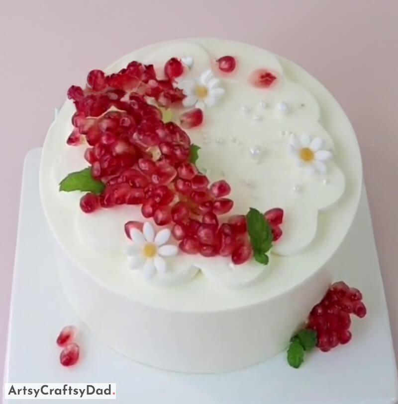 Peeled Pomegranate Topping Decoration on White Cake - Creative Cake-Making with Fruits