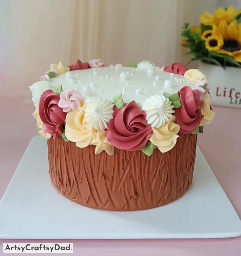 Realistic Tree Stump Cake Design Idea With Colorful Flowers - Impressive Flower Cake Visuals