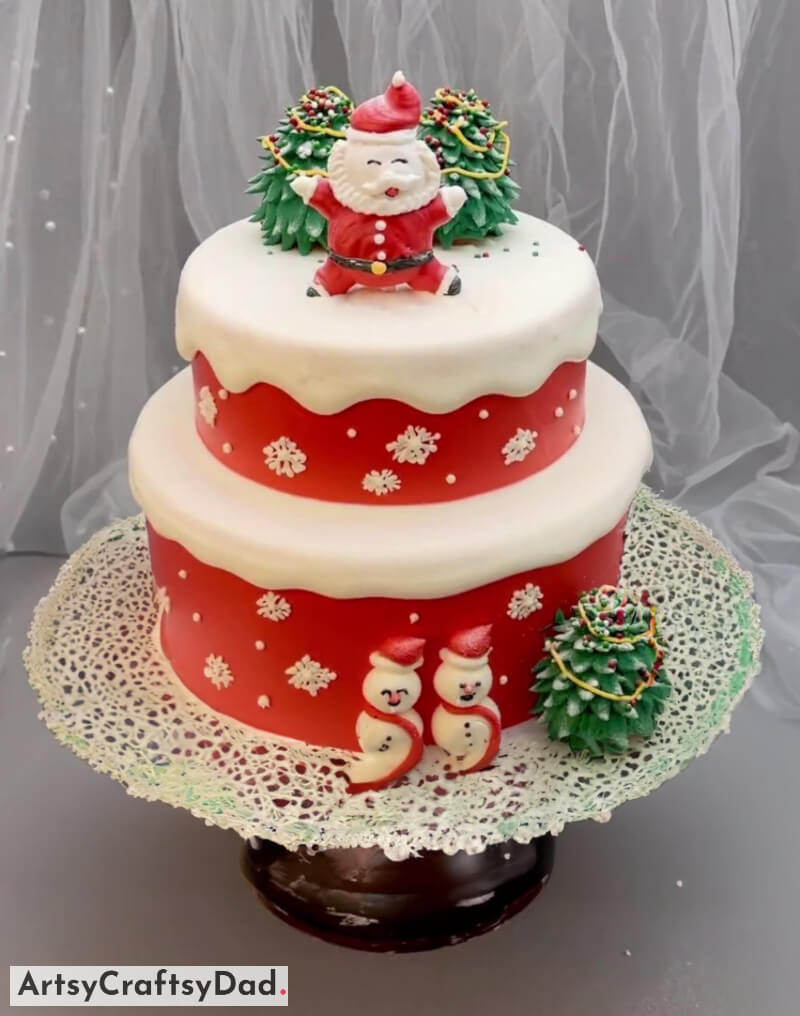 Santa Claus Topper on Two-Tier Cake Decoration Idea - Ideas to Make Your Christmas Cake Look Fabulous and Spread Joy