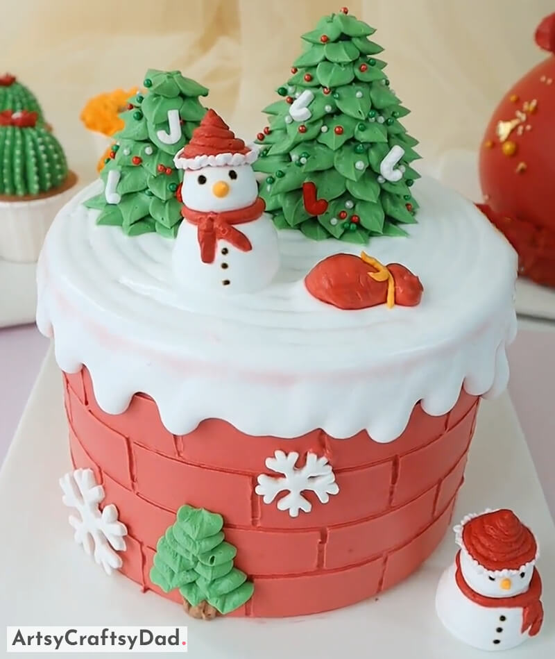 Snowman and Christmas Tree on Brick Wall Cake Decoration - Decorating Ideas to Make Your Christmas Cake Look Amazing 