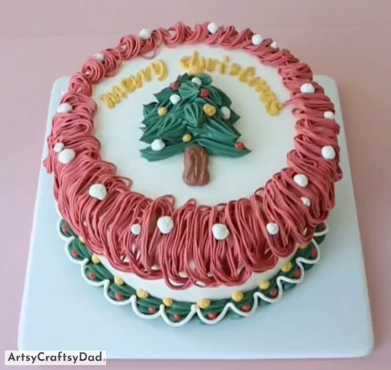 Unique Buttercream Design with Christmas Tree Topper - Cake Decoration - A Festive Cake with a Tree and Snowman Topper Theme