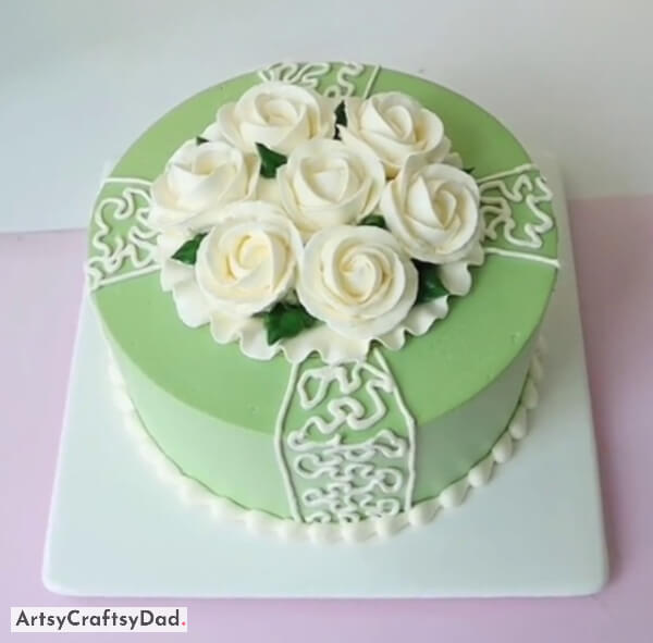 White Buttercream Roses Decoration on Mint Green Cake - Home bakers can utilize these delightful and effortless cake decoration ideas