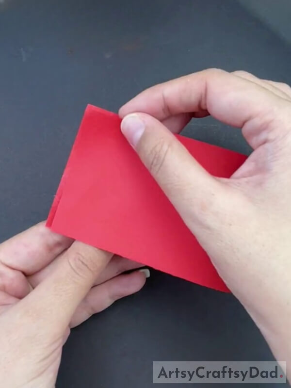 Folding Red Paper Into Half