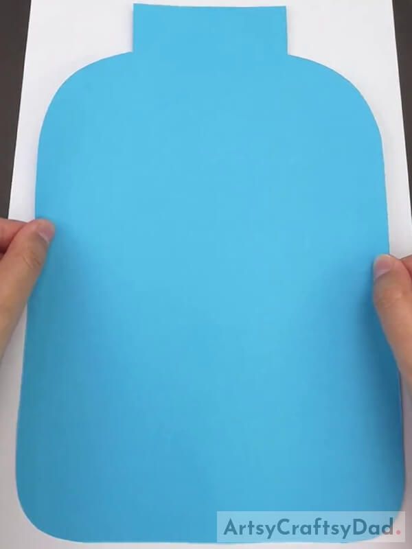 Pasting the Sky Blue Paper Cut-Out on White Paper