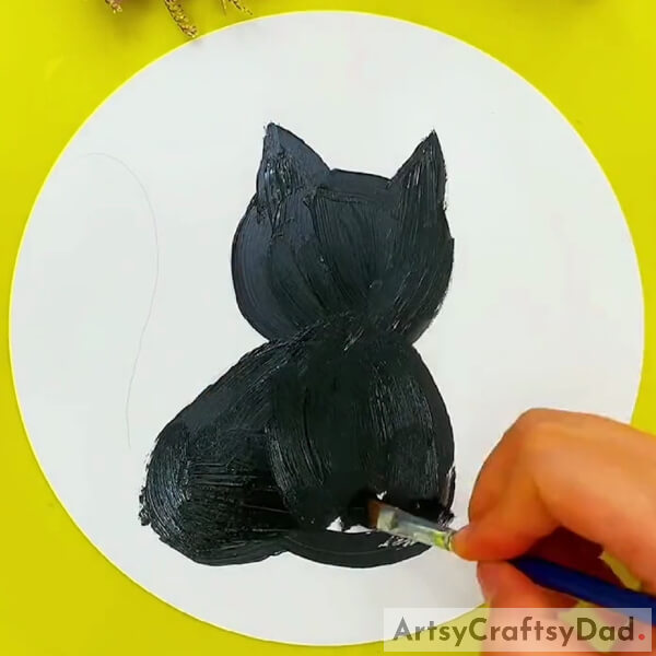 Painting Cat Shape With The Black Paint