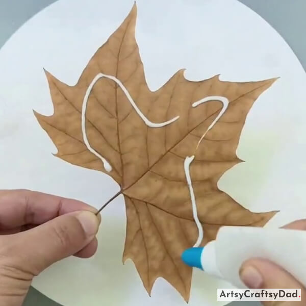 Applying Glue On Lacy Maple Leaf
