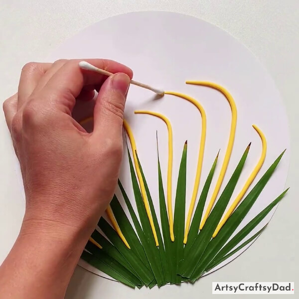 Drawing Dots Of Yellow Paint Using Cotton Buds