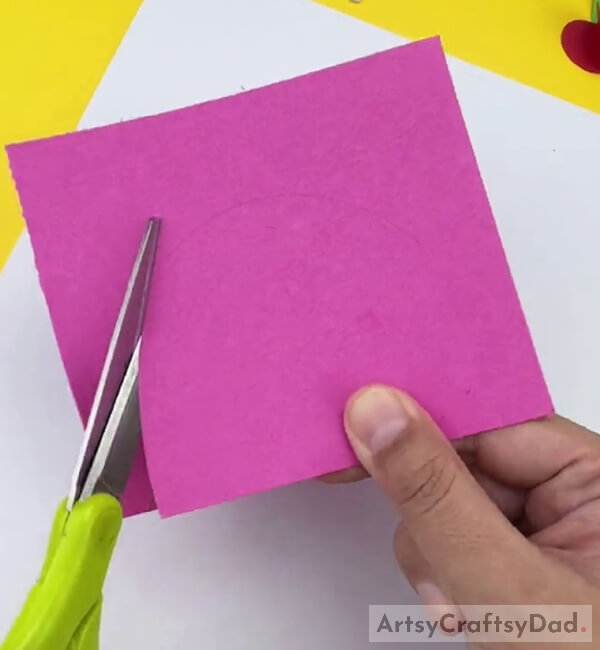Cutting a Pink Color Paper
