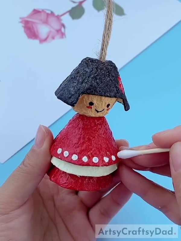 Detailing the Doll Using Earbud