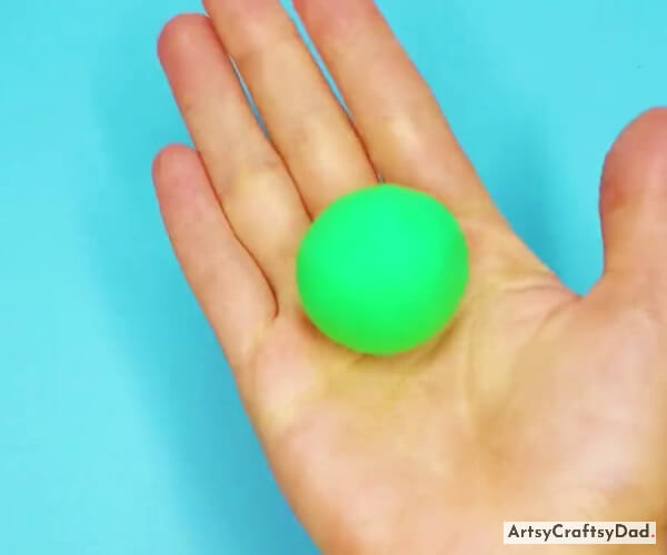 Making a Ball of Green Color Clay