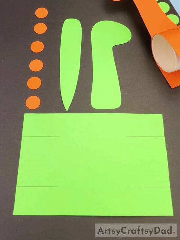 Taking a Green And Orange Paper
