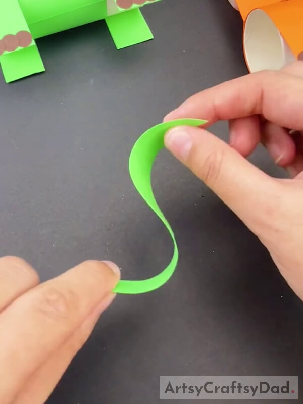 Cutting Green Paper Into Thin Strip