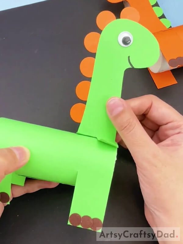 Pasting Dinosaur head on Paper Roll