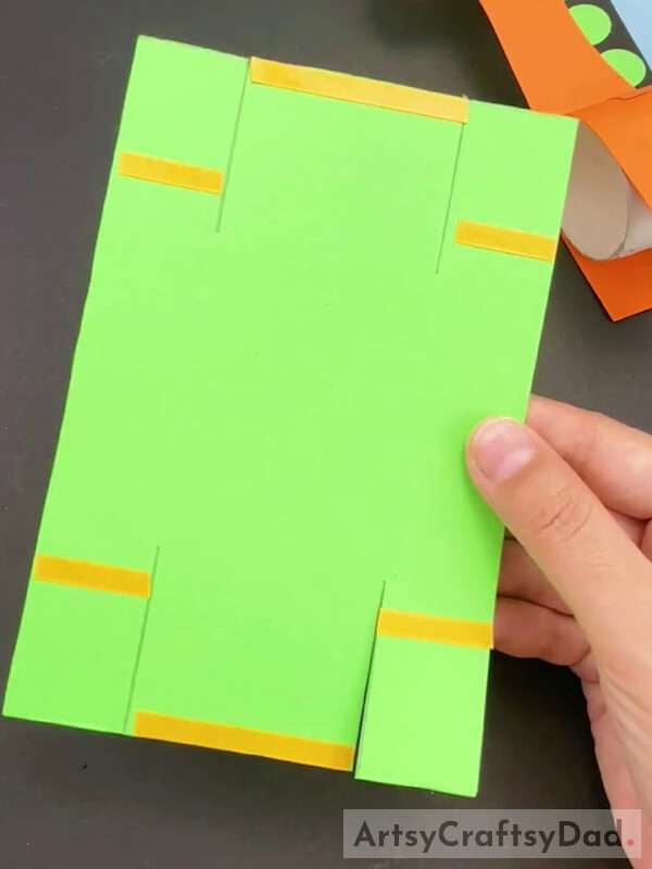 Cutting Tape And Pasting On Green Paper