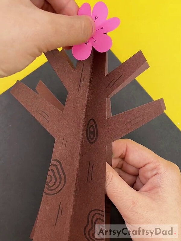 Pasting Flower Cutouts on Trunk