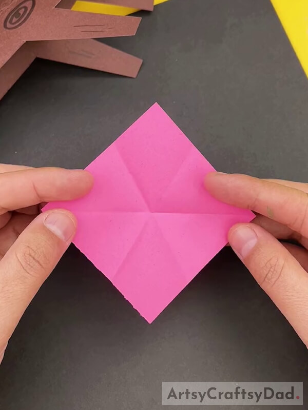 Cutting a Square Shape From Pink Paper