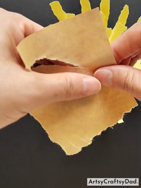 Tearing Brown Paper in Circular form