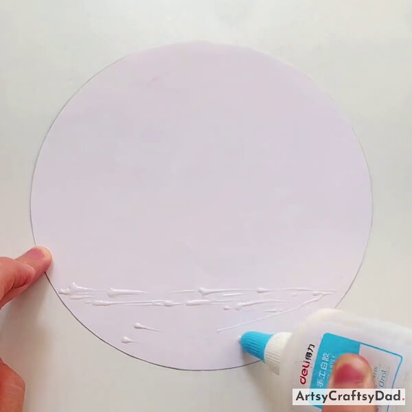 Applying Glue on White Circle Paper