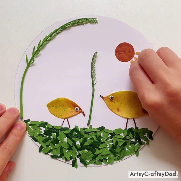 Pasting Yellow Leaf Strips Around The Sun