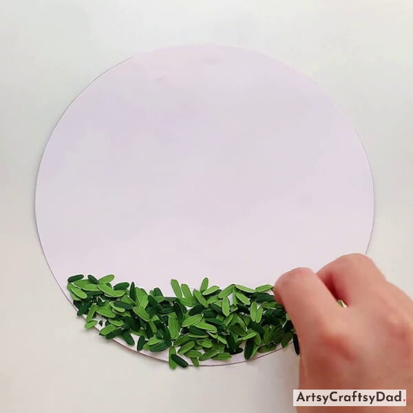 Pasting Green Leaves on White Circle Paper