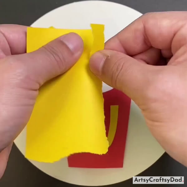 Tearing Yellow Paper for Fries
