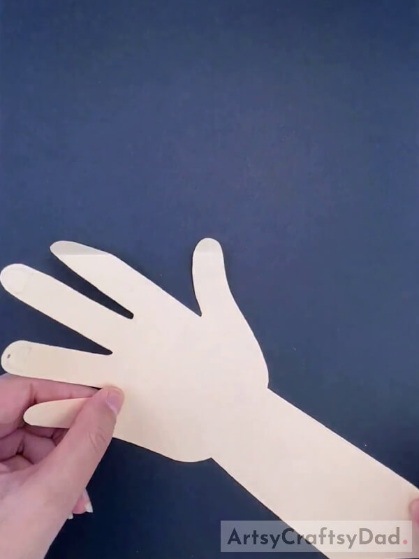 Cutting a Paper Into the Shape of the Hand
