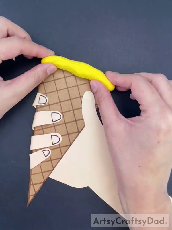 Pasting Clay on Top of the Cone