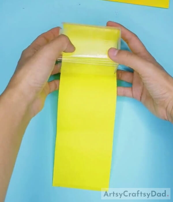 Pasting Paper on the Plastic Bottle