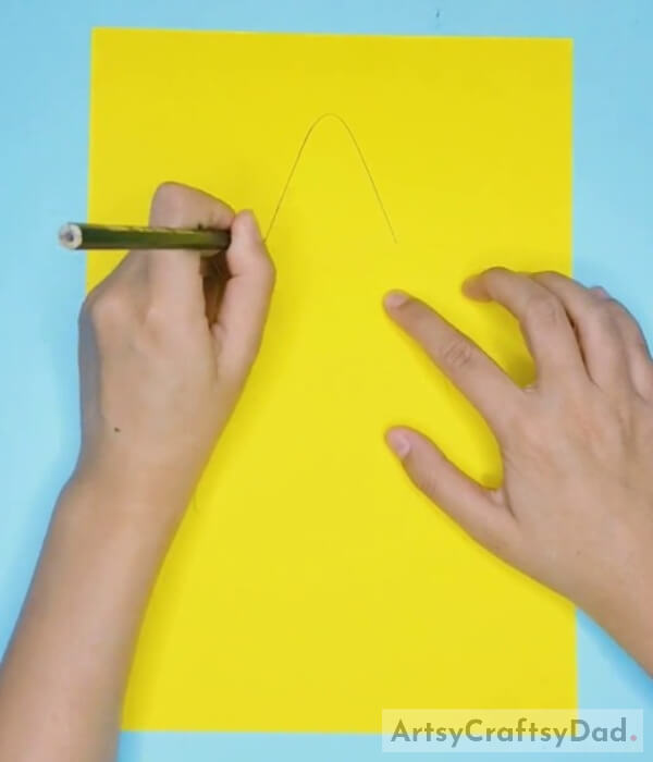 Drawing Star on Yellow Paper