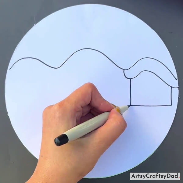 Drawing A House Using A Black Marker