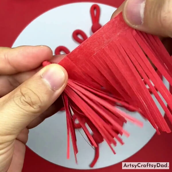 Making A Tassel Using Red Paper