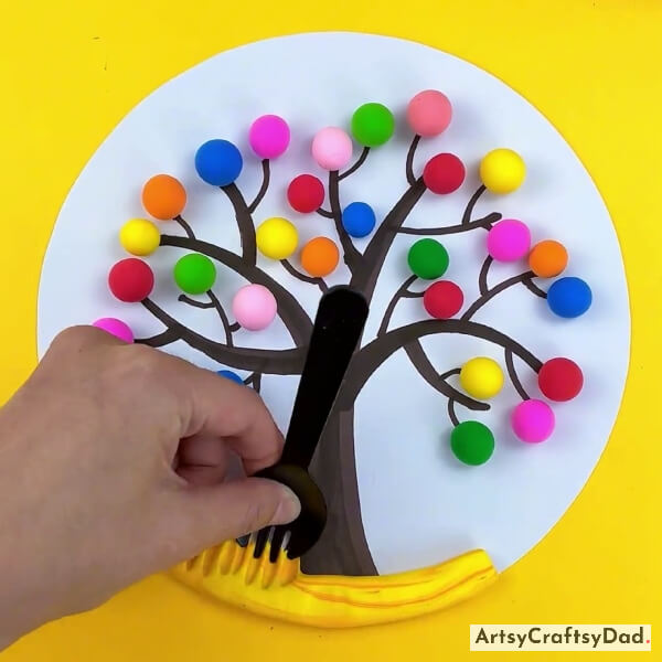 Spreading Clay With Fork