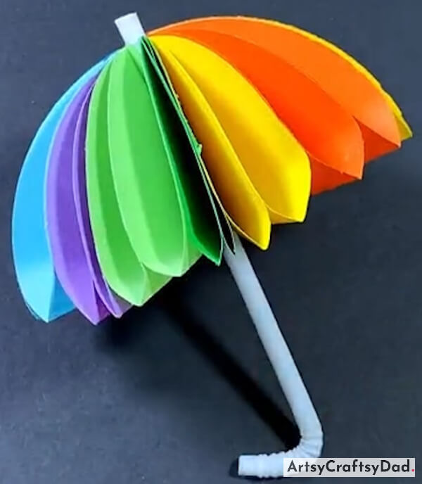 Colorful Origami Paper Umbrella Craft Idea For Kids-Children can enjoy hours of entertainment by crafting unique and colorful origami paper creations