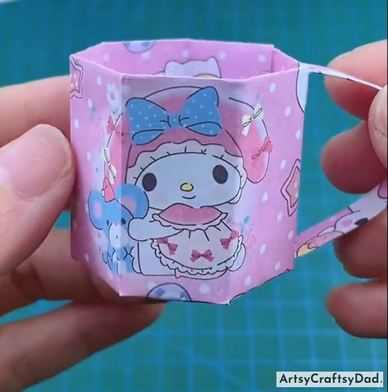 Cute Cartoon Origami Cup Craft For Kids-Engaging in origami paper crafts allows children to experiment with different colors and designs
