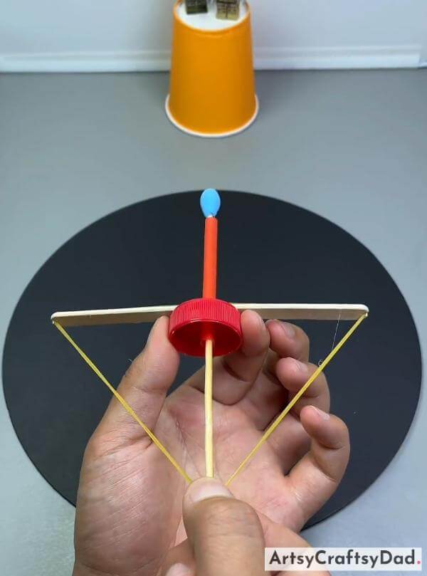 DIY  Bow and Arrow Craft - Using a Popsicle Stick, Bottle Cap & Toothpick-Creative activities for kids that promote learning through hands-on experiences. 