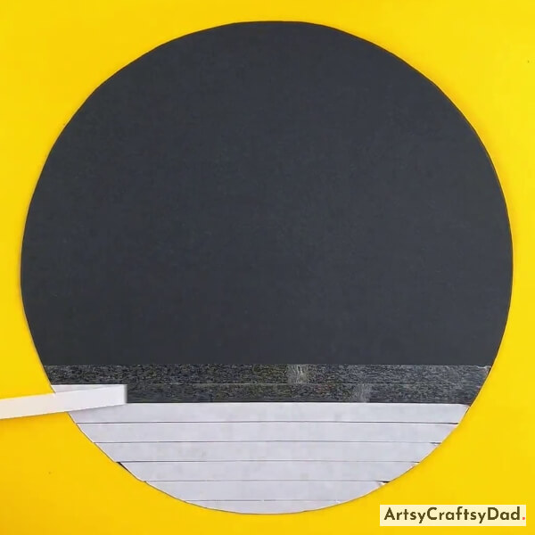 Pasting Double-Sided Tape On A Black Paper Circle