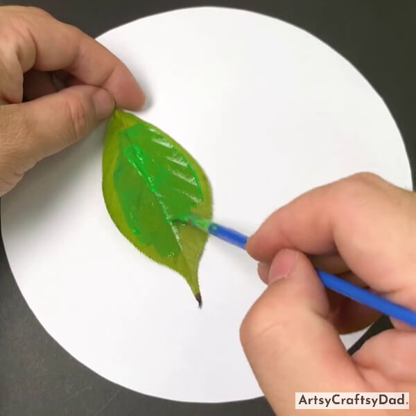 Applying Colour On A Tree Leaf