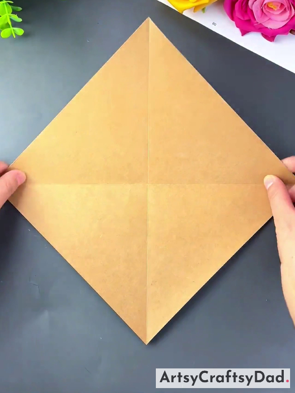Folding The Paper To Make Creases