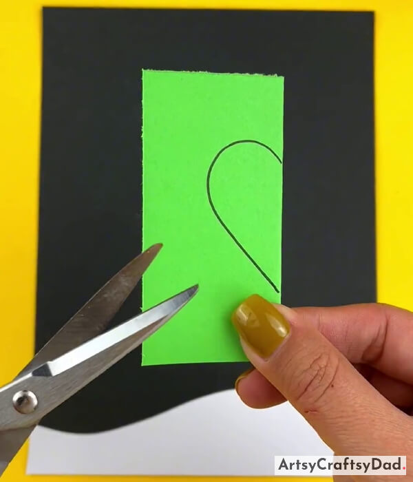 Drawing A Half Heart Shape On Half Folded Paper