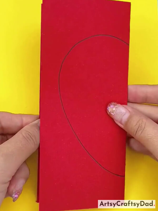 Drawing Heart On Red Sheet