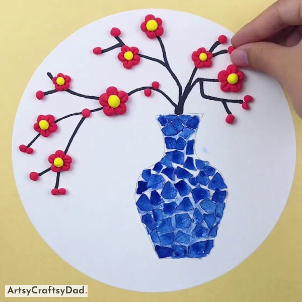 Pasting Small Clay Balls On Branches