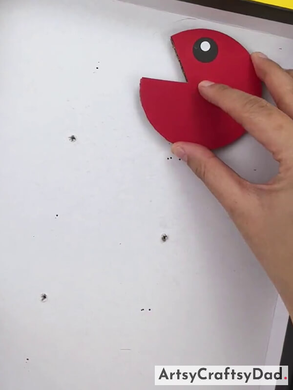 Making Hole In White Cardboard
