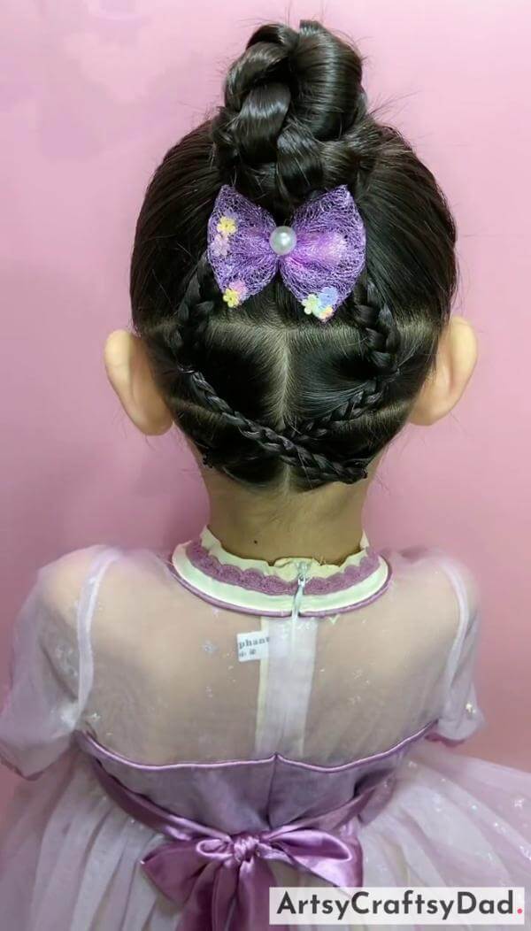 A Complete Braided Bun Hairstyle for Kids-Sweet hairclips for a bun hairstyle on children.