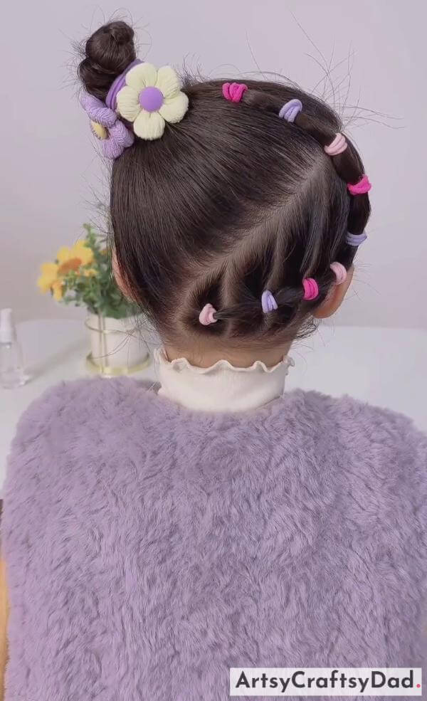 A Side Beads Braided Bun Hairstyle for Kids-Charming hair accessories to complement children's braided bun hairstyle.